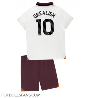 Manchester City Jack Grealish #10 Replika Bortatröja Barn 2023-24 Kortärmad (+ Korta byxor)
